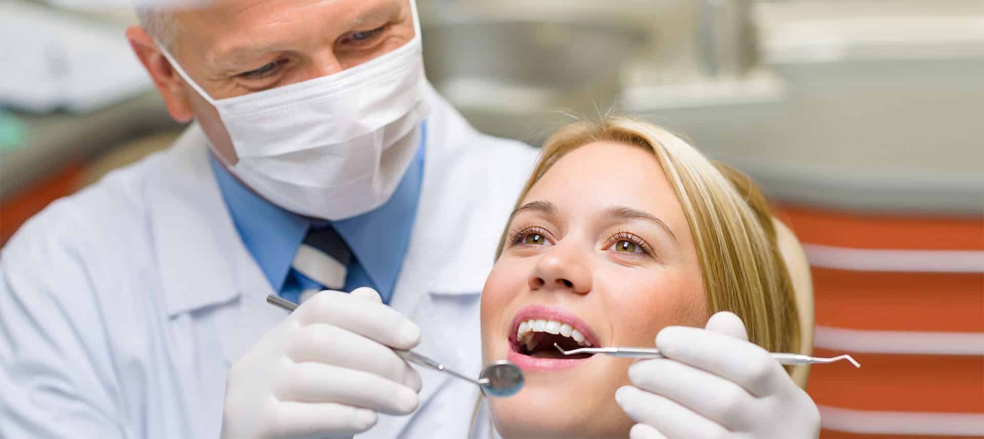 Dentist explaining why a regular cleaning might not be recommended