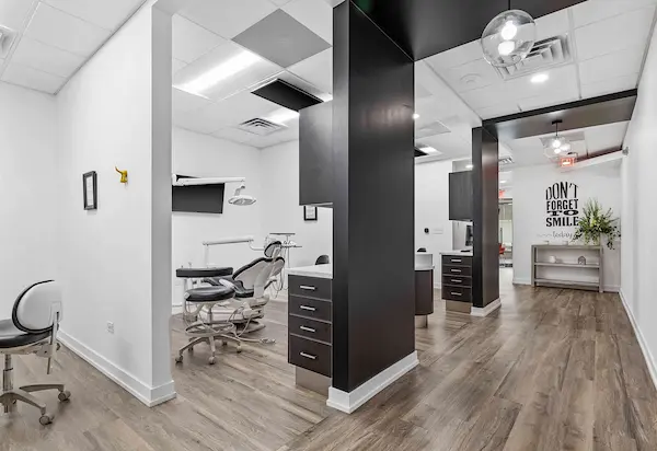 A modern architecture of a beautiful office displaying state of the art Operatory with a ceiling and wall mounted TVs.