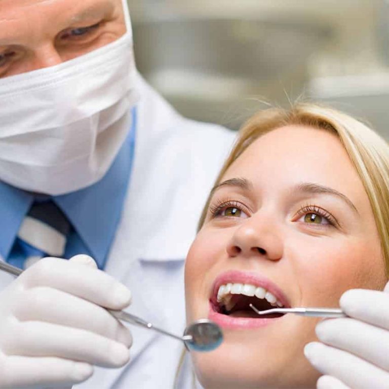 Dentist explaining why a regular cleaning might not be recommended